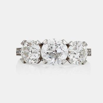 523. An old-cut three stone diamond ring. Total carat weight circa 3.90 ct.