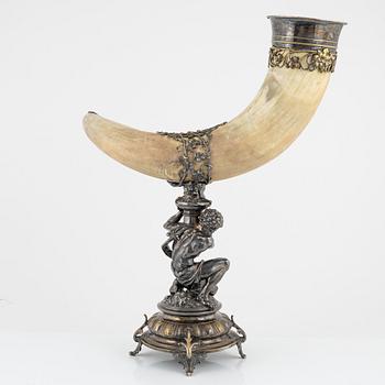 An early 20th century drinking horn with silver plated mount and base.