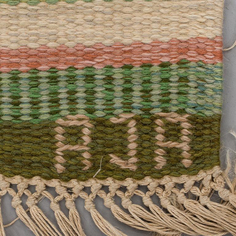 A CARPET, flat weave, ca 247 x 167,5 cm, signed AJA.