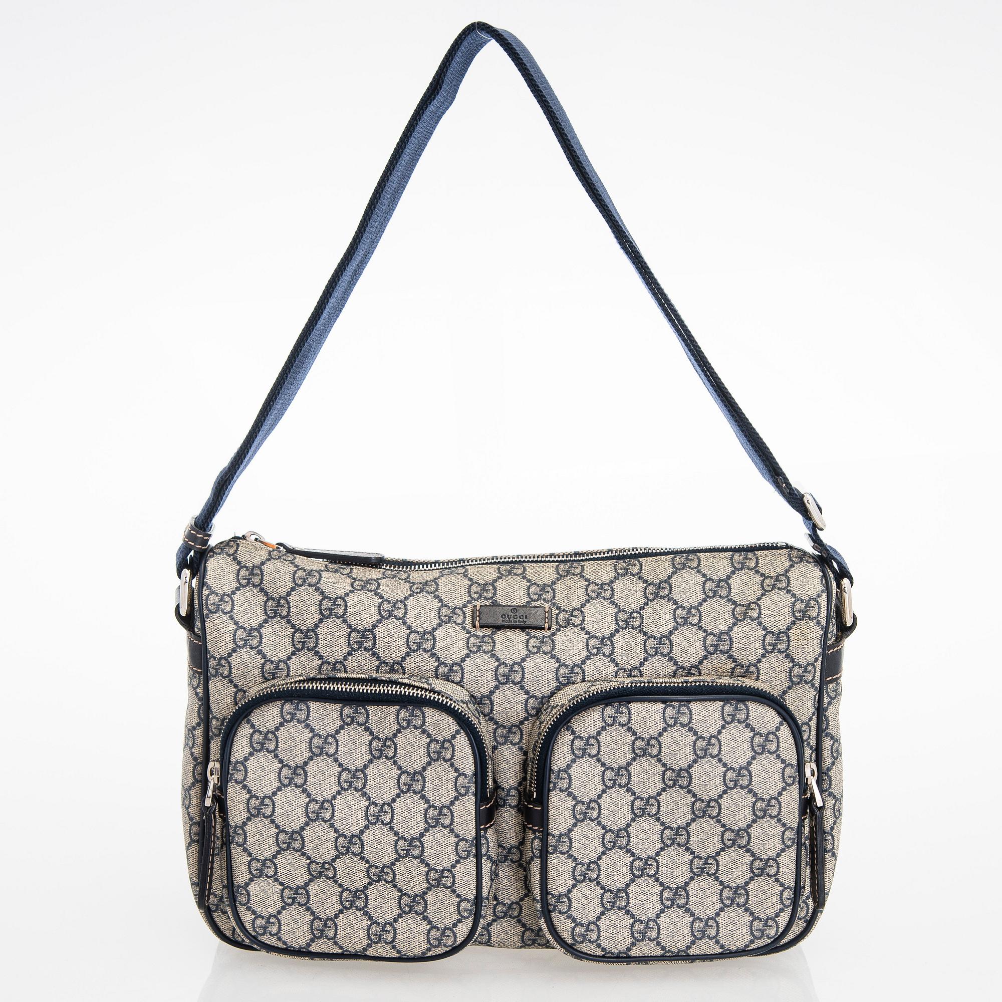 Gucci, A "GG Supreme messenger" bag.