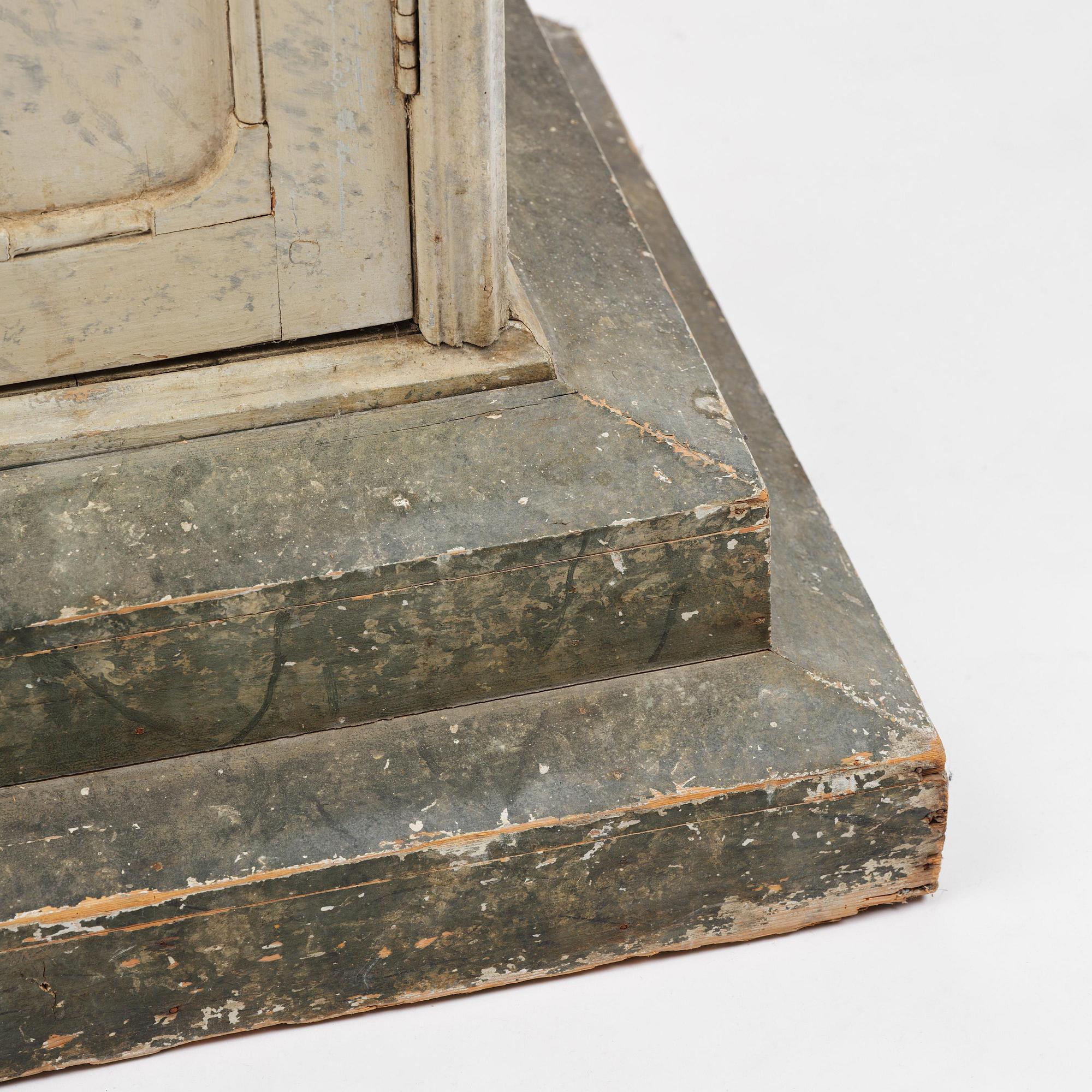 A Swedish column-shaped cabinet 19 th century.
