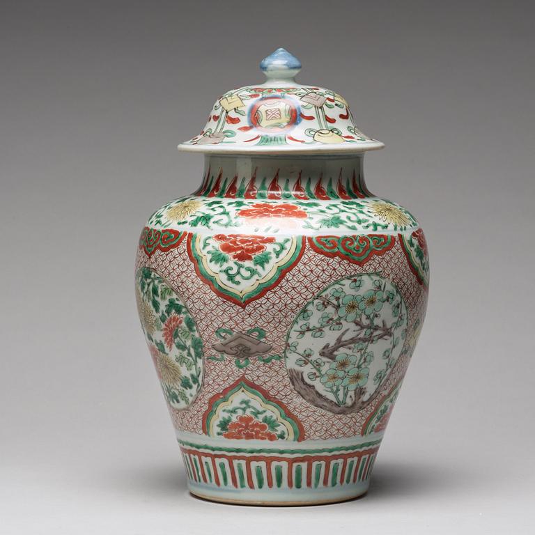 A Transitional wucai baluster vase with cover, 17th Century.