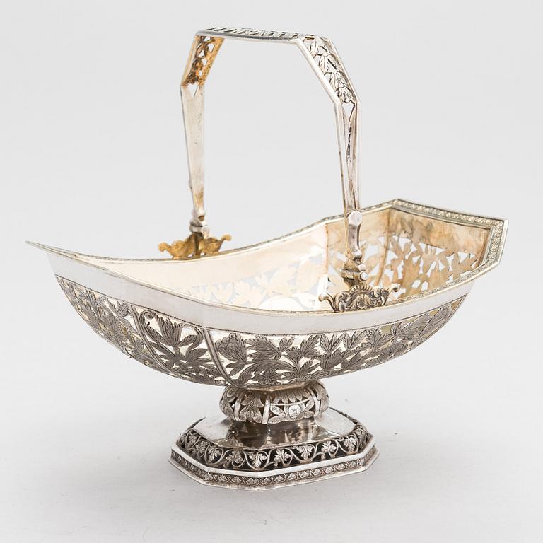 A Russian, parcel-gilt silver swing handle basket, Moscow 1834.
