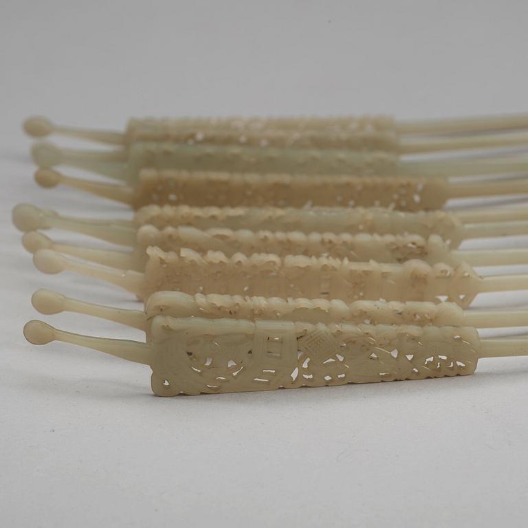 A set of ten carved pale celadon nephrite hairpins, late Qing dynasty (1644-1912).