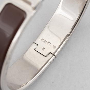 Hermès, a 'Clic H' bracelet.