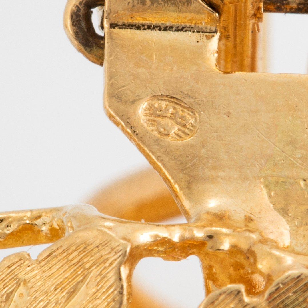 A pair of 18K gold earrings.