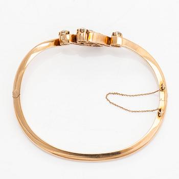 A 14K gold bangle, set with old-cut diamonds, St. Petersburg 1882-1898.