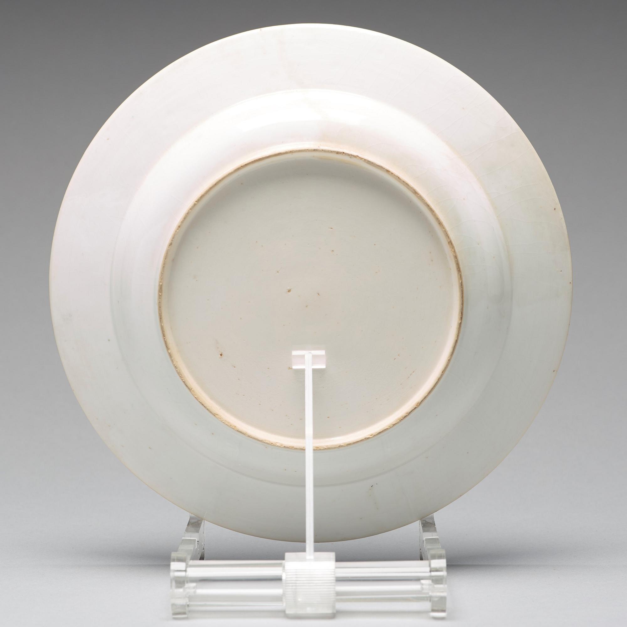 A set of eight blue and white armorial soup dishes, Qing dynasty, 18th Century.