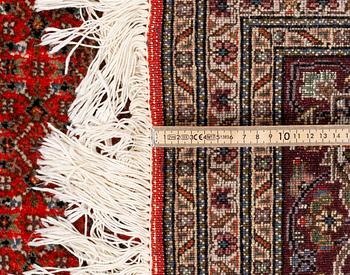 A carpet, Tabriz, part silk, 40-50 Radj, ca 300 x 195 cm.