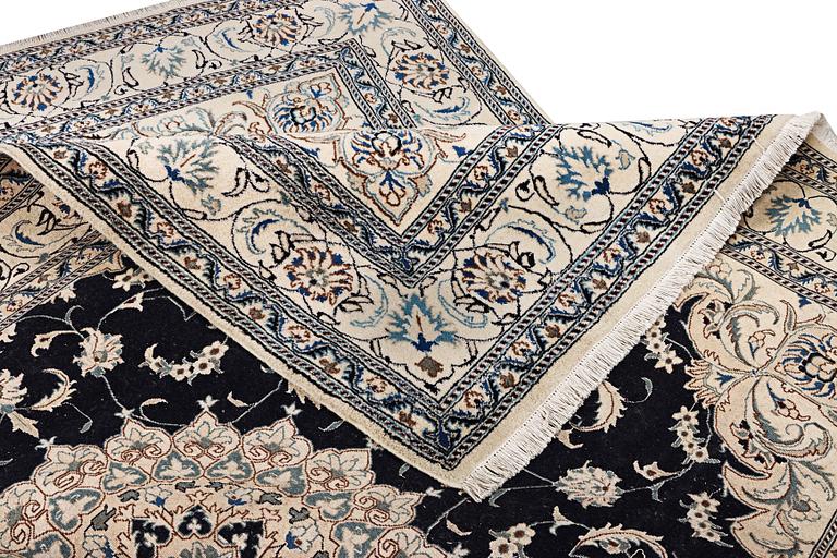 A Nain carpet, part silk, c. 303 x 200 cm.