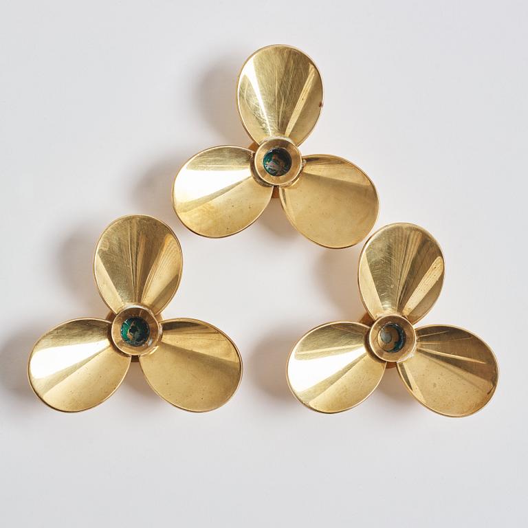 Pierre Forssell, three brass 'Treklövern' candleholders, Skultuna, 1981.