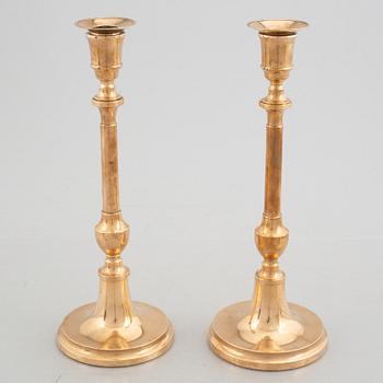 Two pairs of brass candlesticks, 19th century - early 20th century.