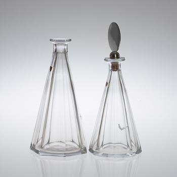Two Wiwen Nilsson and Orrefors glass decanters, the one with a sterling stopper, Lund 1949.