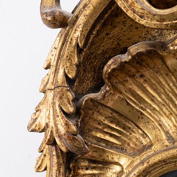 A Rococo mirror, 18th century.
