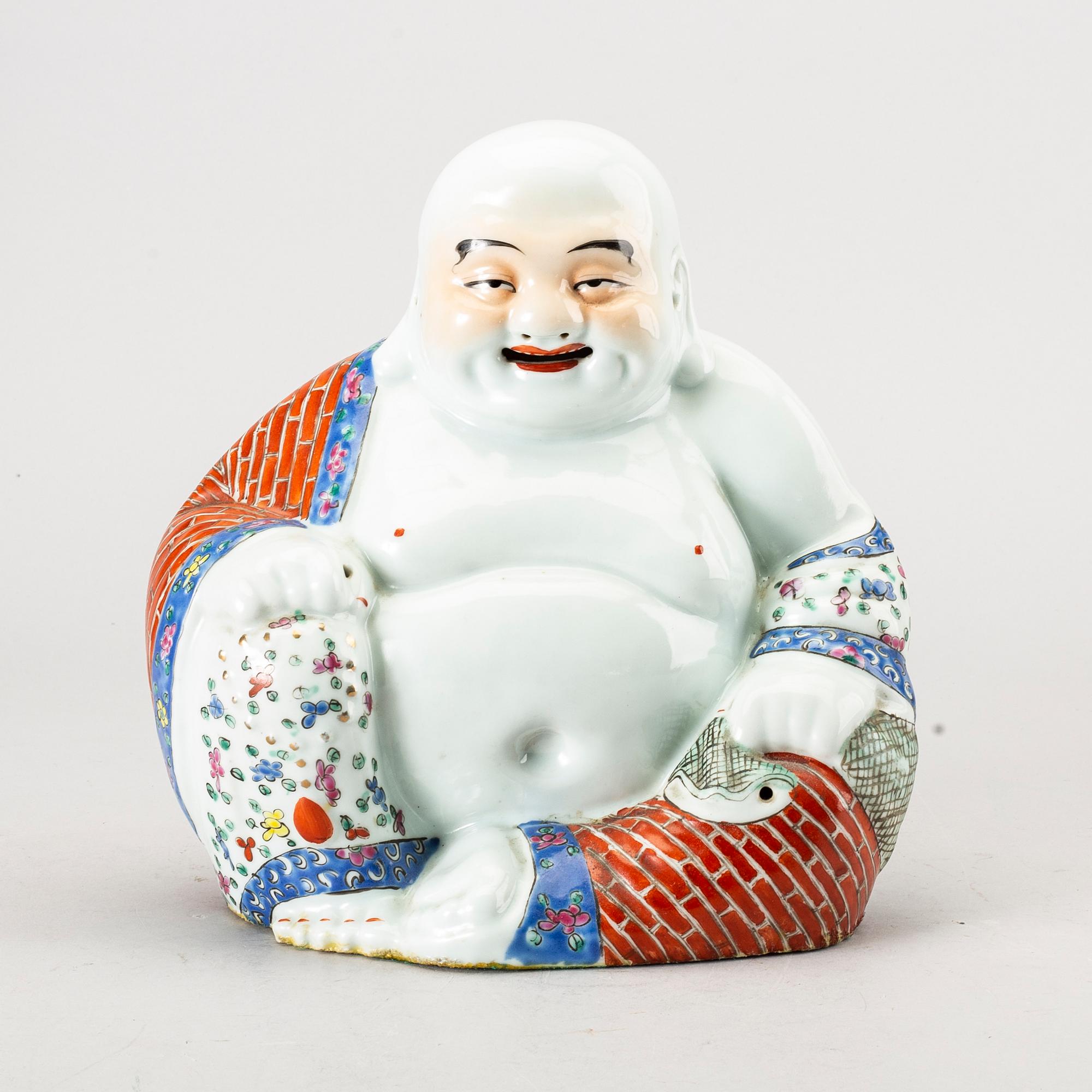 A Chinese porcelain buddha, 20th century.