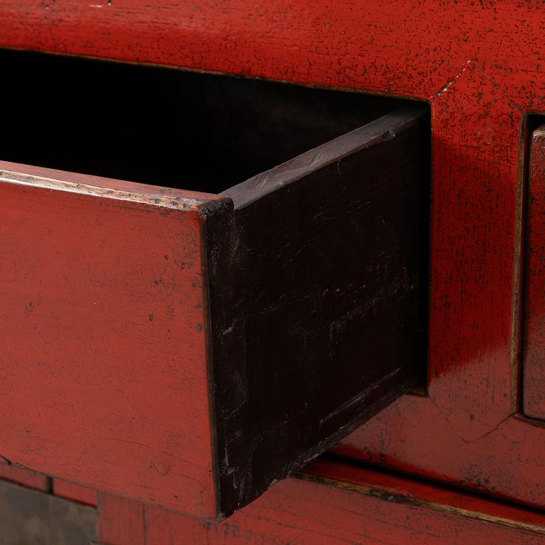 A Chinese red lacquered cabinet, 20th century.
