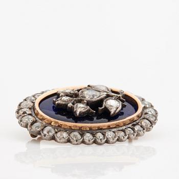 A blue enamel, rose-and old cut diamond brooch. Early 19th century.