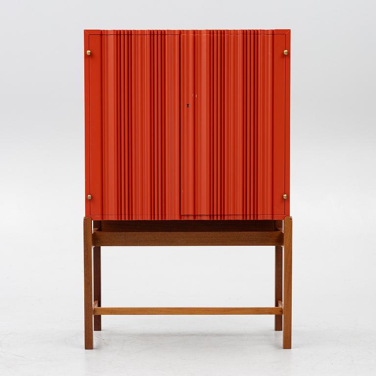 Josef Frank, a red lacquered cabinet, model 2192, 'The Cardboard Cabinet' by Svenskt Tenn, after 1985.