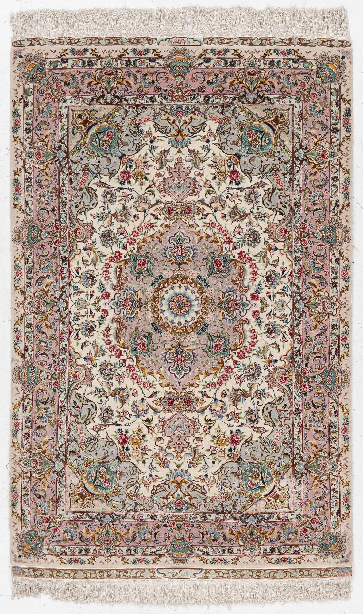 A Tabriz rug, signed, c. 160 x 101 cm.