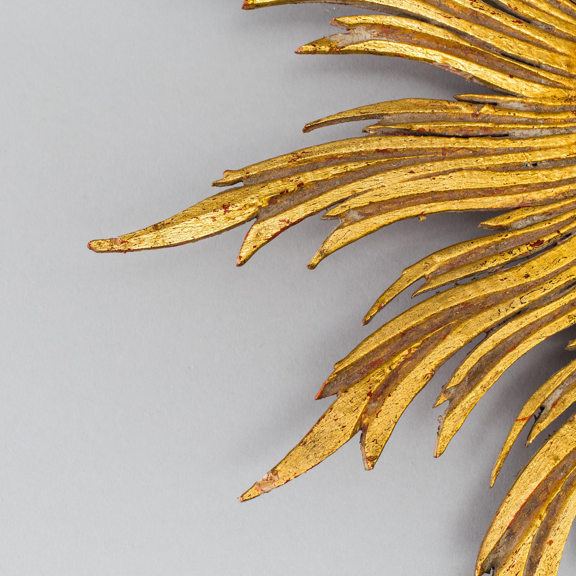 A mirror in shape of a sun, second half of the 20th century.