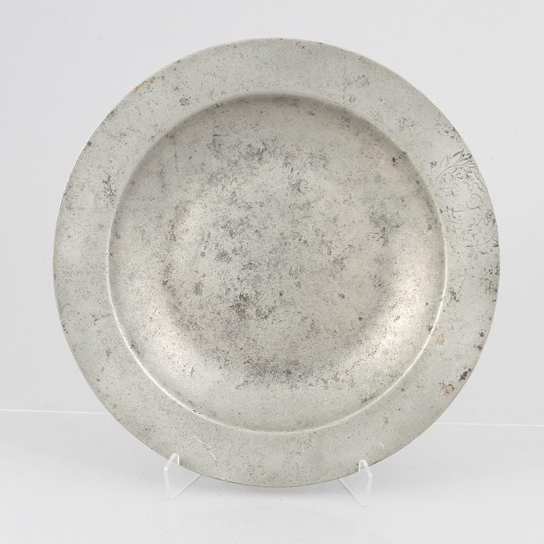 A large pewter charger, Sweden, dated 1701.