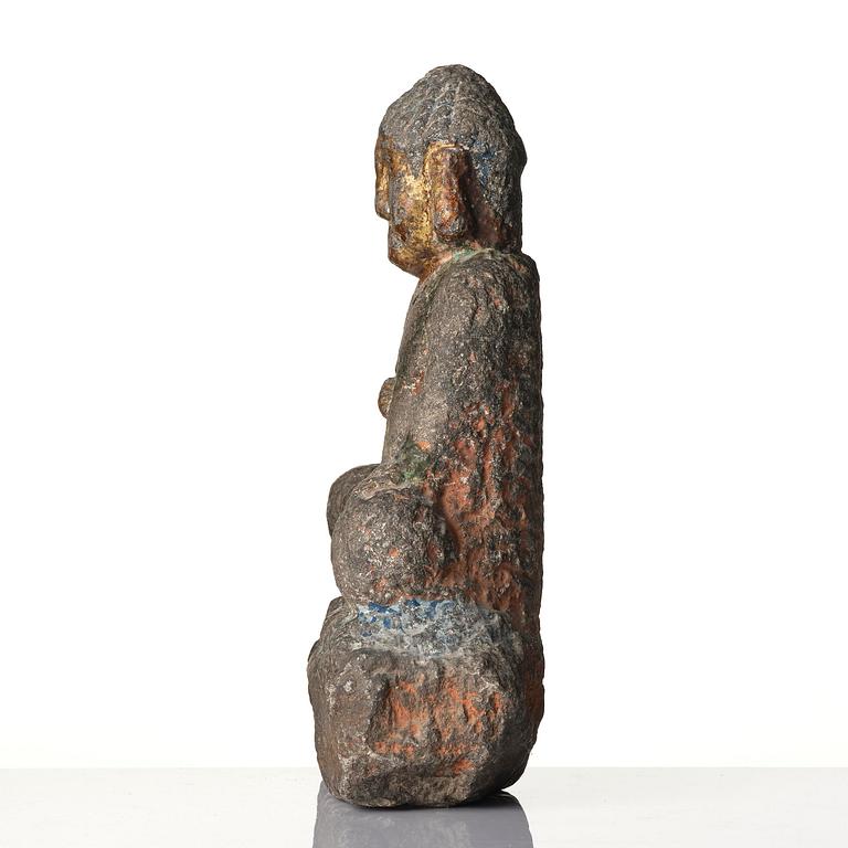 A stone sculpture of Buddha, Ming style.