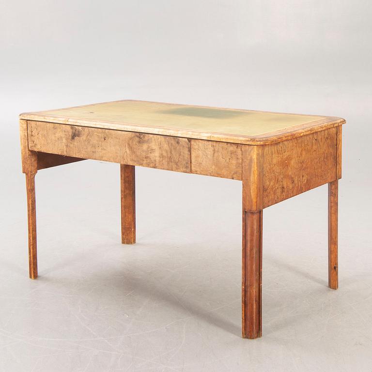 A mid 1800s birch Empire writing desk.