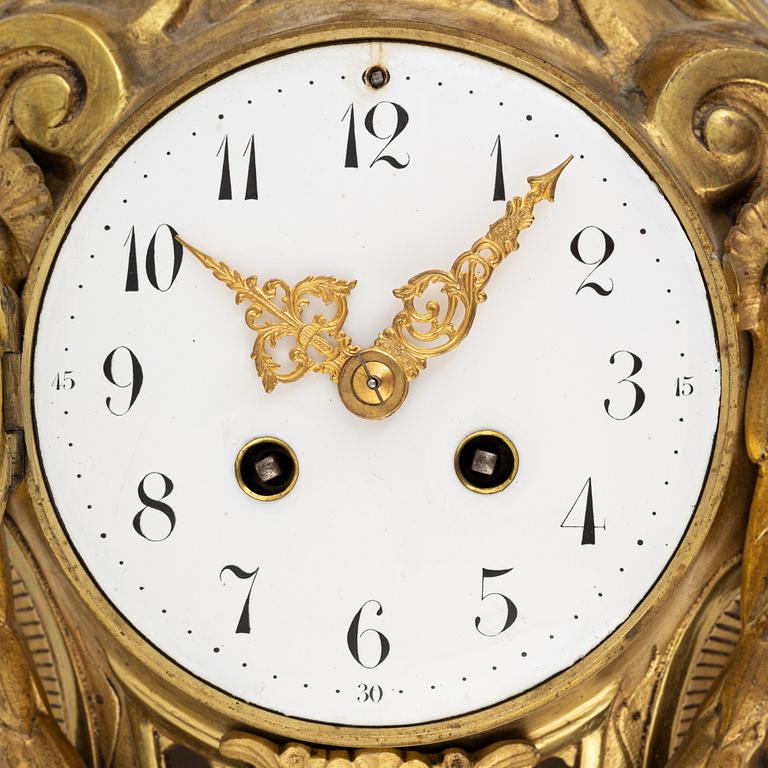 A Louis XVI-style wall clock, first half of the 20th Century.