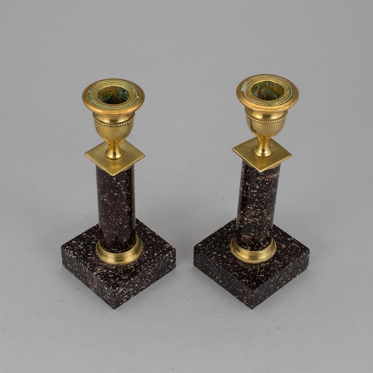 A pair of late gustavian porphyry candle sticks early 19th century.