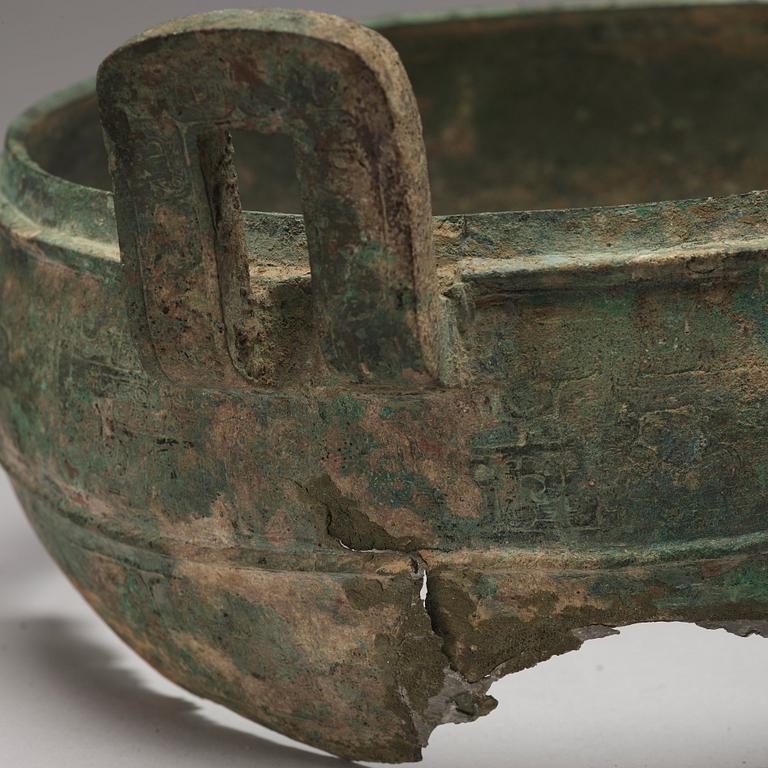 A bronze tripod food vessel and cover, "Ding", Eastern Zhou Dynasty.