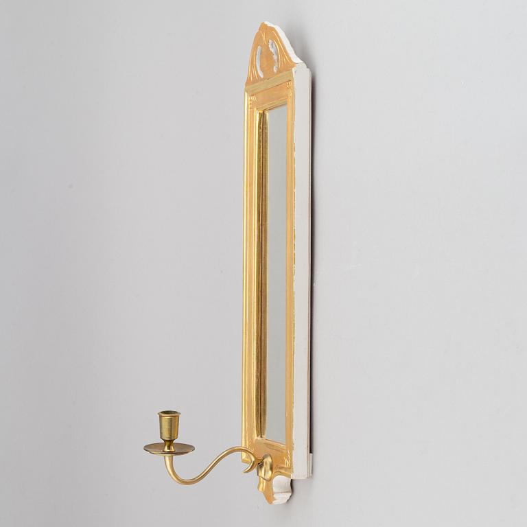 A 'Regnaholm' Gustavian style mirror sconce from Ikea, 1990.