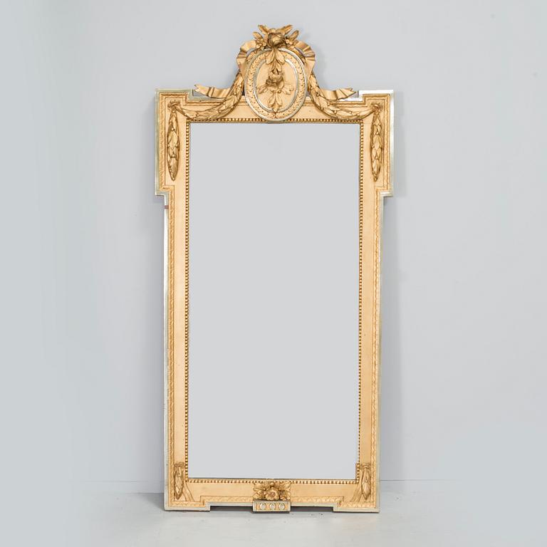 A gustavian mirror by Per Westin, signed PW and with the Stockholm hallmark 1777.