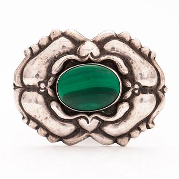 A jugend silver brooch with a malakite.