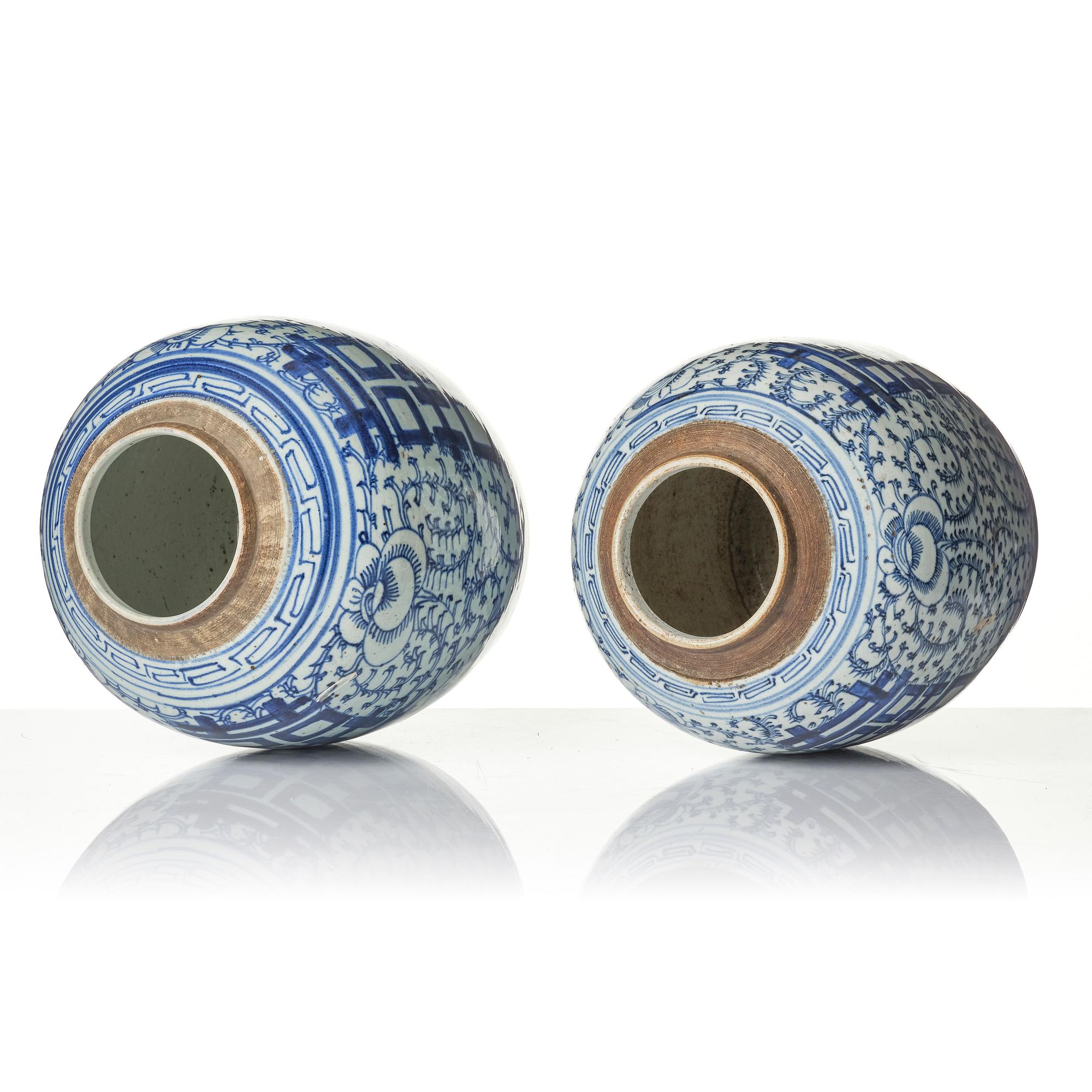 A pair of blue and white porcelain pots with covers, China, 19th century.