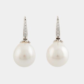 Freshwater pearl and brilliant cut diamond earrings.