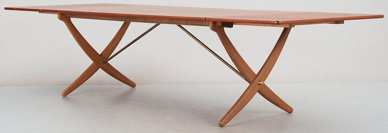A Hans J Wegner teak and oak sabre leg dinner table by Andreas Tuck, Denmark 1950-60's.