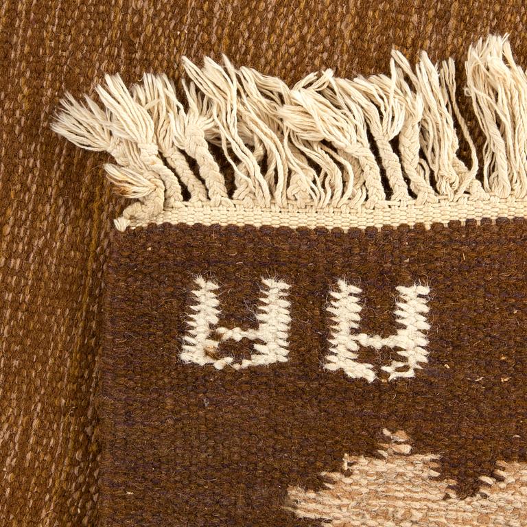 A signed Swedish flatweave carpet ca 207 x 137 cm.