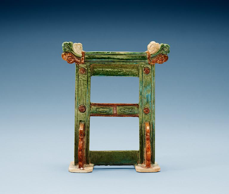 A green and brown glazed pottery stand/gate, Ming dynasty (1368-1644).