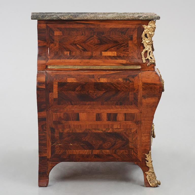 A Swedish early rococo parquetry, ormolu-mounted and marble commode, presumably by S. Pasch or J. Wulf , ca. 1740.