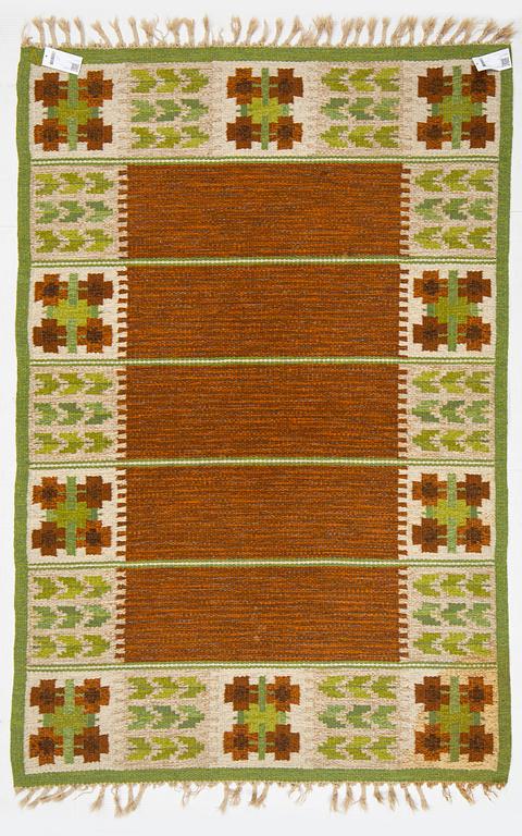 Berit Woelfer, a flat weave carpet, signed WB, ca 203 x 139 cm.