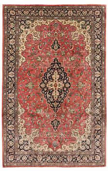 A 1960's silk Qum carpet, c. 312 x 201 cm.
