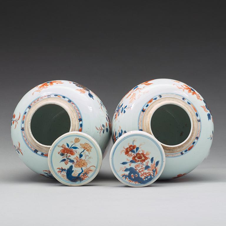 A pair of imari jars with covers, Qing dynasty, 18th Century.
