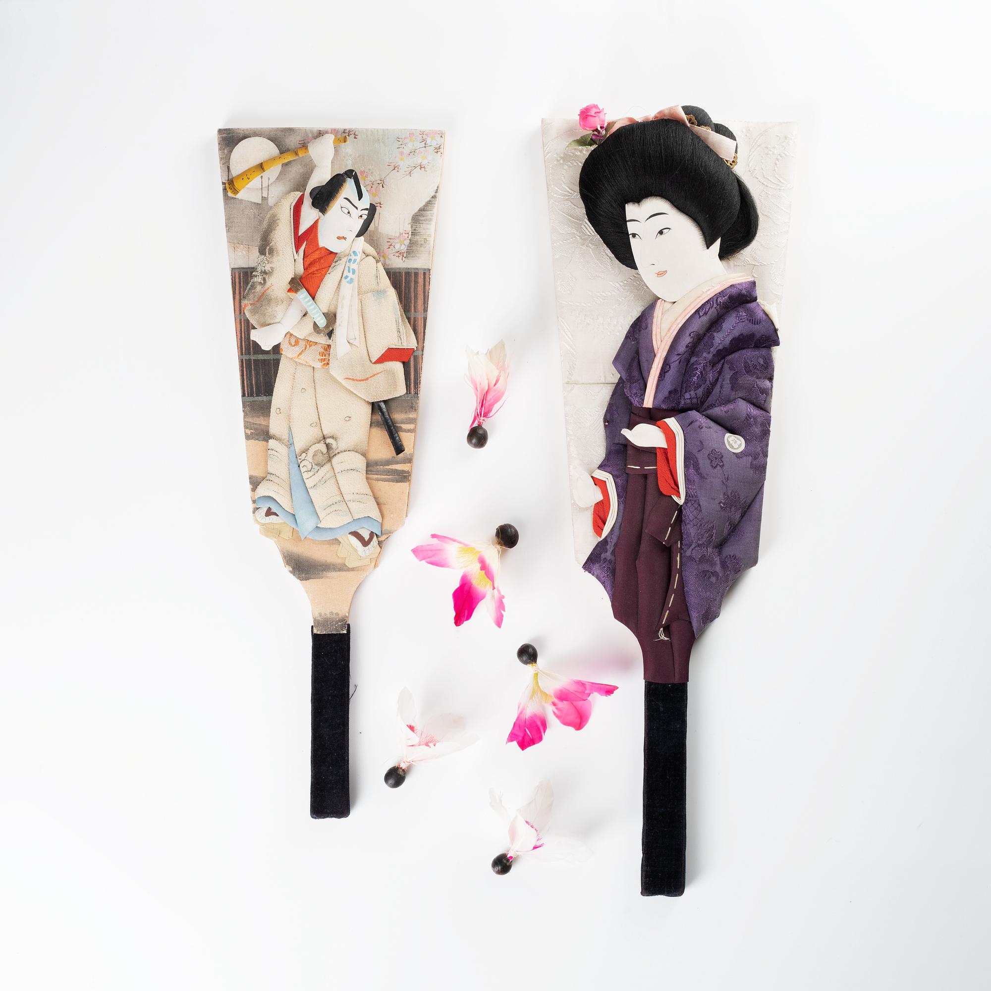 A set of two Japanese hagoita wooden paddles and five shuttlecocks, first part of 20th century.