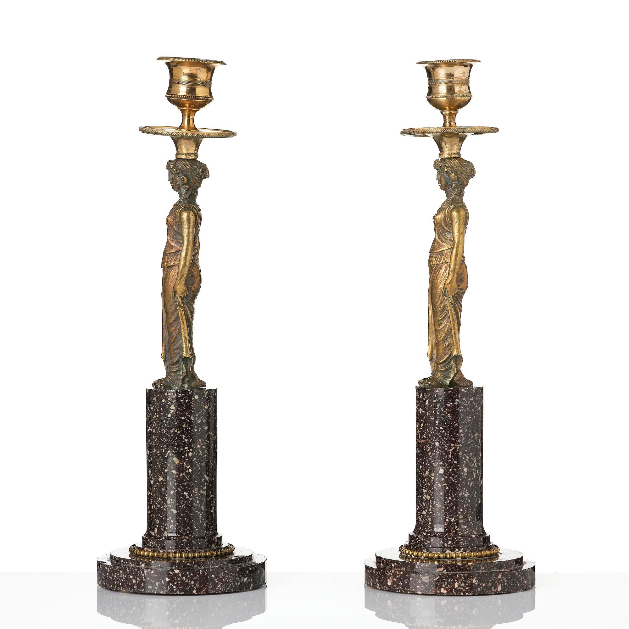 A pair of late Gustavian gilt brass and 'Blyberg' porhyry candlesticks in the manner of F. L. Rung, early 19th century.