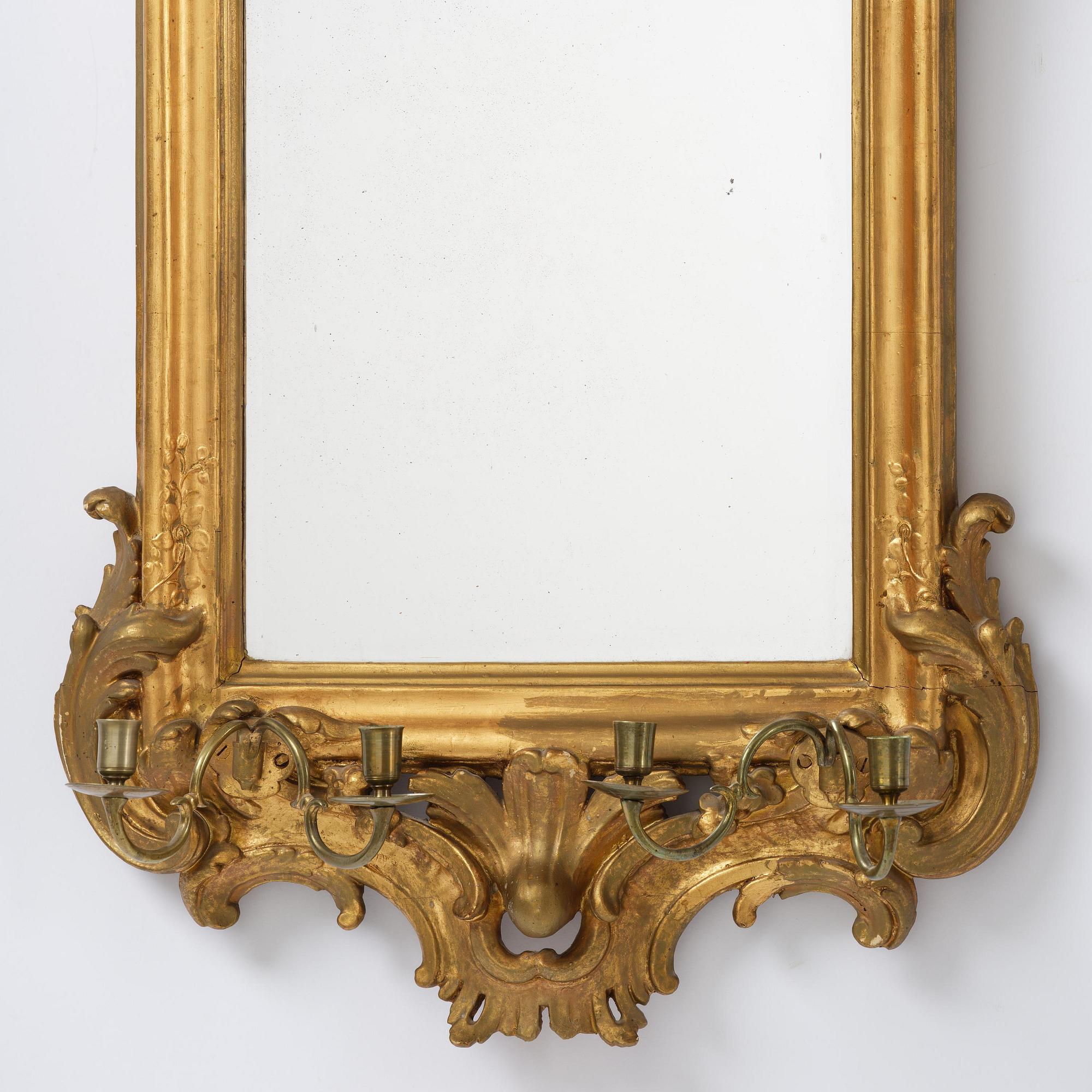 A Swedish rococo giltwood four-branch girandole mirror, Stockholm, later part 18th century.