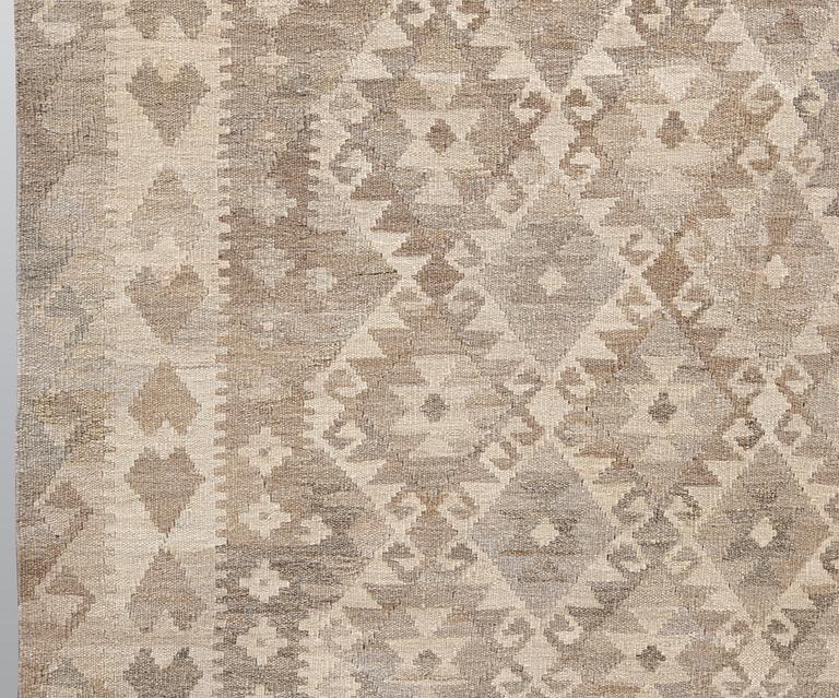 A kilim carpet, ca 290 x 208 cm.