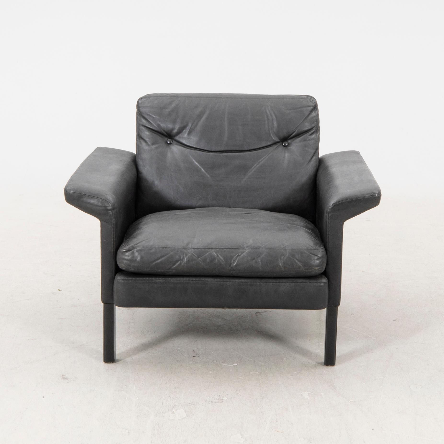 A 1960/70s Hans Olsen leather armchair.