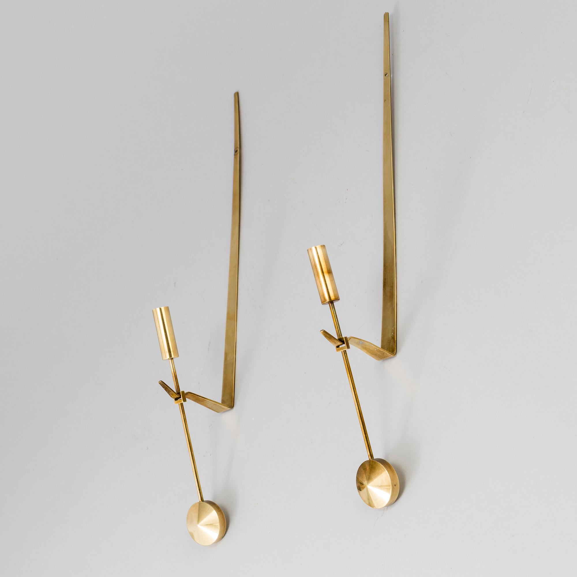 A pair of brass wall candle holders by Pierre Forsell, Skultuna.