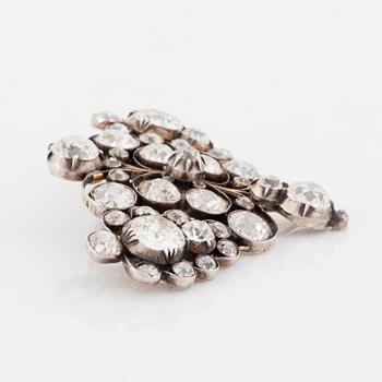 A gold and silver brooch set with old-cut diamonds.