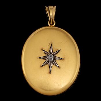 BERLOCK, 14k guld med fasettslipad diamant och onyx, trol Ryssland, 1900-tal. Vikt 27 g.